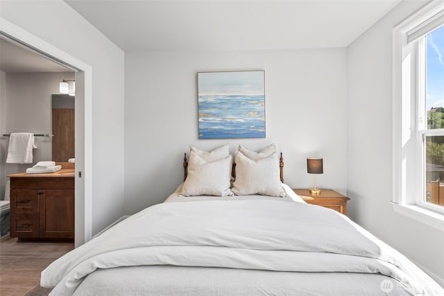 4961 Main St Unit 719, Tacoma, WA 98407 - bedroom with ensuite bath and wood finished floors