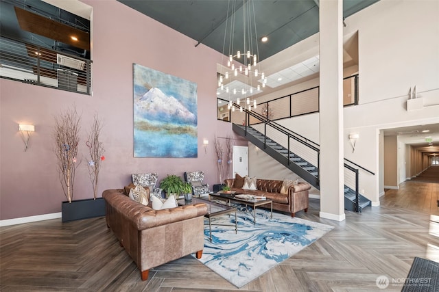 4961 Main St Unit 719, Tacoma, WA 98407 - living room with stairs, a chandelier, a high ceiling, and recessed lighting