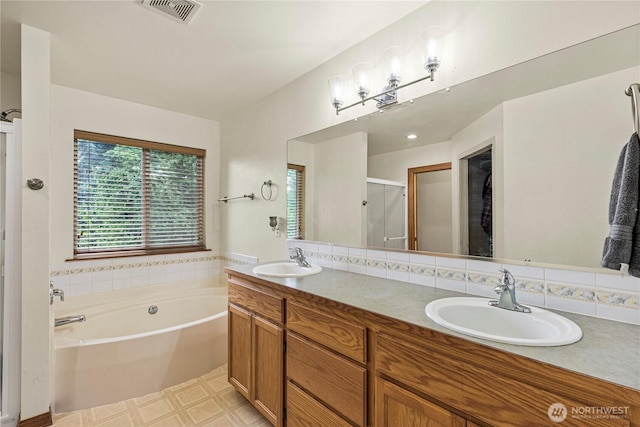 20523 193rd Avenue Ct E, Orting, WA 98360 - bathroom with a shower stall, a garden tub, and double vanity