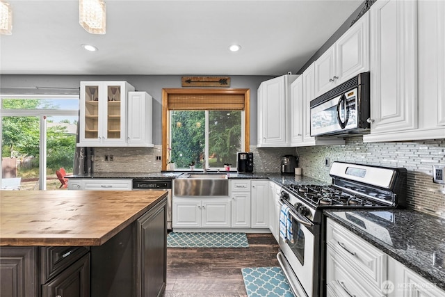 20523 193rd Avenue Ct E, Orting, WA 98360 - kitchen featuring gas stove, wooden counters, dishwashing machine, white cabinetry, and recessed lighting