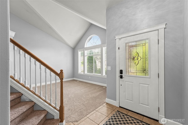 20523 193rd Avenue Ct E, Orting, WA 98360 - carpeted entrance foyer with tile patterned flooring, vaulted ceiling, and stairs