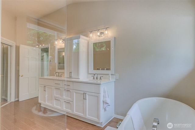18915 SE 284th Ct, Kent, WA 98042 - bathroom with a freestanding bath, double vanity, and wood finished floors