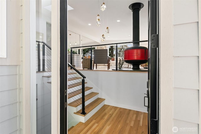 12569 37th Ave NE, Seattle, WA 98125 - staircase featuring wood finished floors and a wood stove