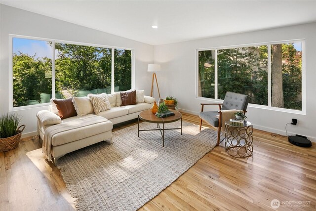 12569 37th Ave NE, Seattle, WA 98125 - living area featuring healthy amount of natural light, wood finished floors, and recessed lighting