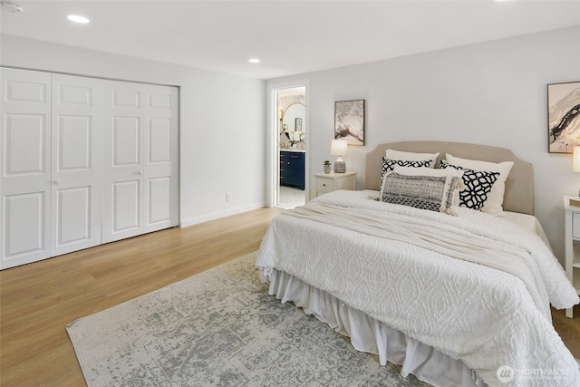 12569 37th Ave NE, Seattle, WA 98125 - bedroom with wood finished floors, recessed lighting, a closet, and connected bathroom