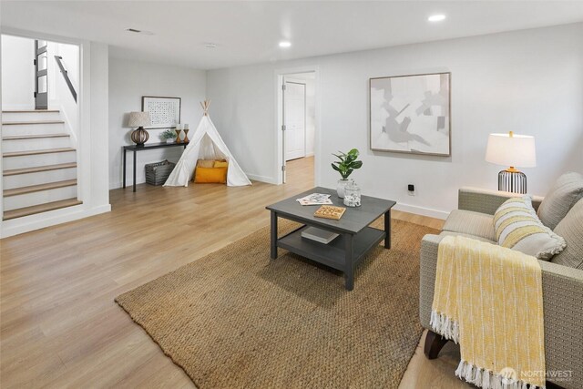 12569 37th Ave NE, Seattle, WA 98125 - living room featuring recessed lighting, light wood-type flooring, and stairway