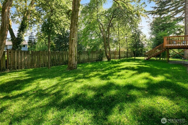 12569 37th Ave NE, Seattle, WA 98125 - fenced backyard with stairway and a deck