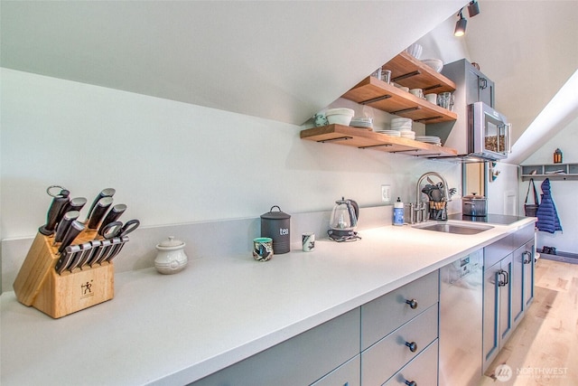 87 Levon Ln, Orcas Island, WA 98243 - kitchen with open shelves, stainless steel appliances, gray cabinets, light wood-style floors, and light countertops