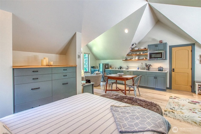 87 Levon Ln, Orcas Island, WA 98243 - bedroom with light wood finished floors and vaulted ceiling