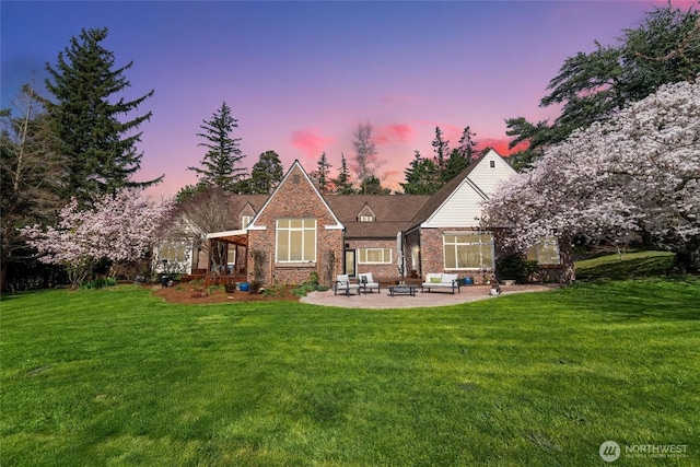 3851 Cliffside Dr, Bellingham, WA 98225 - back of house with a patio, outdoor lounge area, a yard, and brick siding