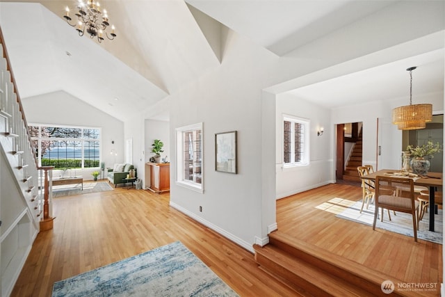 3851 Cliffside Dr, Bellingham, WA 98225 - entryway with a chandelier, stairway, light wood-style flooring, and lofted ceiling