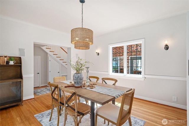 3851 Cliffside Dr, Bellingham, WA 98225 - dining space with stairs, a chandelier, and light wood-type flooring