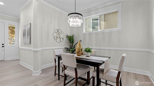 11832 158th Ave NE, Redmond, WA 98052 - dining area featuring ornamental molding, wood finished floors, and a chandelier