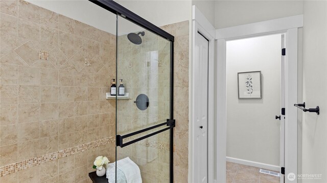 11832 158th Ave NE, Redmond, WA 98052 - bathroom featuring a shower stall and tile patterned flooring