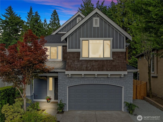 11832 158th Ave NE, Redmond, WA 98052 - view of front of property featuring board and batten siding, an attached garage, concrete driveway, roof with shingles, and stone siding