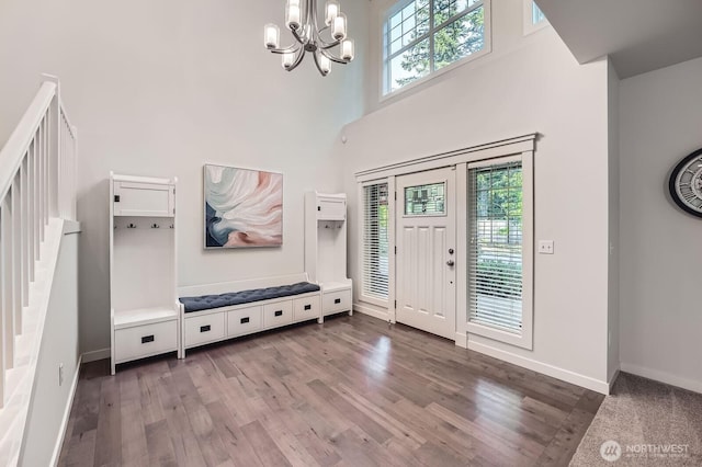 3592 SE 16th St, North Bend, WA 98045 - entryway featuring a chandelier, wood finished floors, a towering ceiling, and stairs