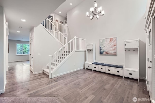 3592 SE 16th St, North Bend, WA 98045 - entryway featuring stairway, wood finished floors, a chandelier, recessed lighting, and a towering ceiling
