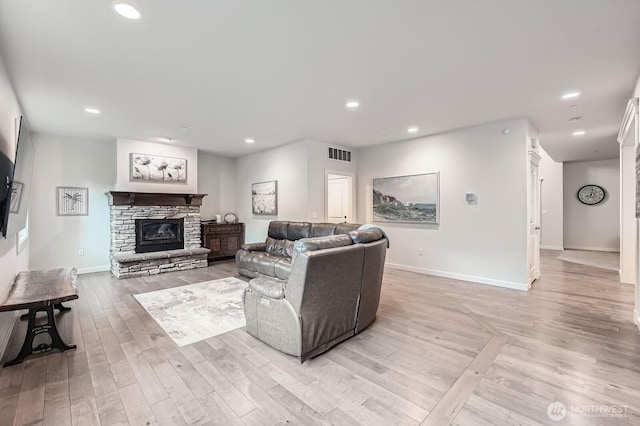 3592 SE 16th St, North Bend, WA 98045 - living area featuring a stone fireplace, light wood finished floors, and recessed lighting