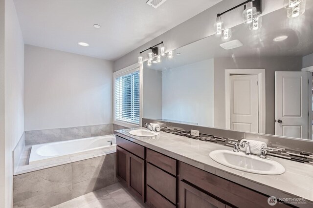 3592 SE 16th St, North Bend, WA 98045 - bathroom with double vanity, a bath, and tile patterned flooring