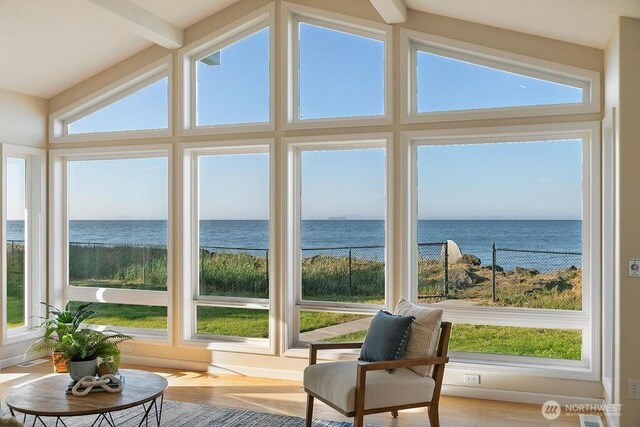 12 Jamestown Beach Ln, Sequim, WA 98382 - sunroom / solarium featuring a water view and wood finished floors