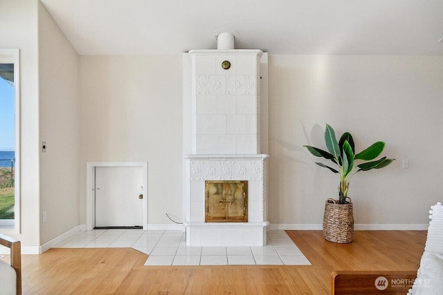 12 Jamestown Beach Ln, Sequim, WA 98382 - living area with a tiled fireplace and wood finished floors