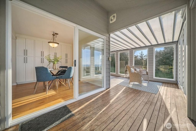 12 Jamestown Beach Ln, Sequim, WA 98382 - sunroom / solarium with hardwood / wood-style flooring and a wooden deck