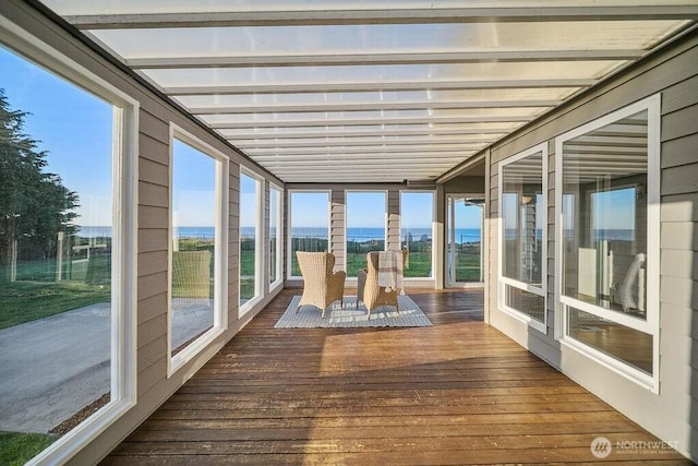 12 Jamestown Beach Ln, Sequim, WA 98382 - unfurnished sunroom with wood-type flooring and a water view