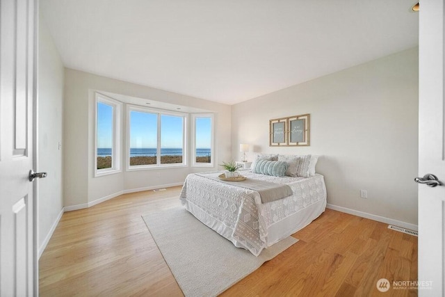 12 Jamestown Beach Ln, Sequim, WA 98382 - bedroom featuring baseboards and light wood-style flooring
