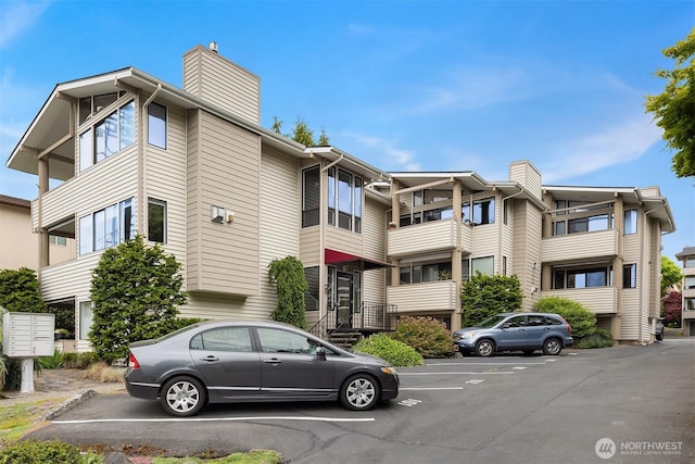 335 3rd Ave S Unit 203, Edmonds, WA 98020 - view of building exterior featuring uncovered parking
