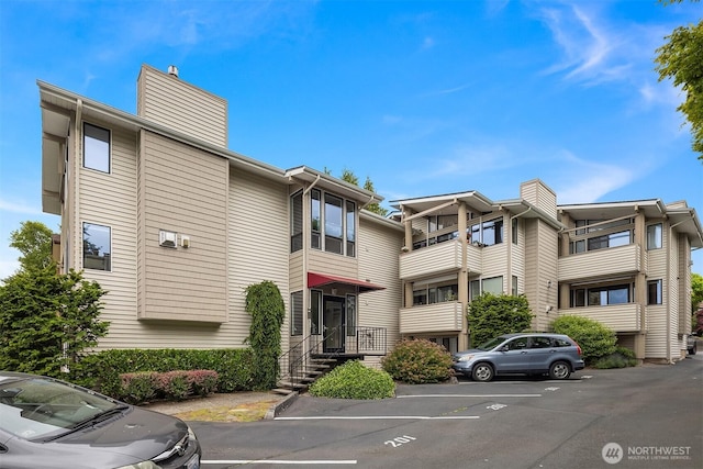 335 3rd Ave S Unit 203, Edmonds, WA 98020 - view of building exterior with uncovered parking