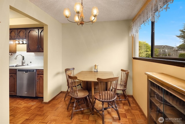 335 3rd Ave S Unit 203, Edmonds, WA 98020 - dining room with a textured ceiling and a chandelier
