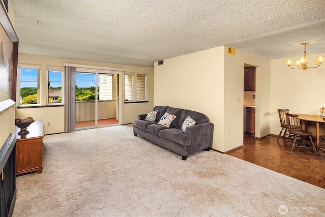 335 3rd Ave S Unit 203, Edmonds, WA 98020 - living area with a chandelier and a textured ceiling
