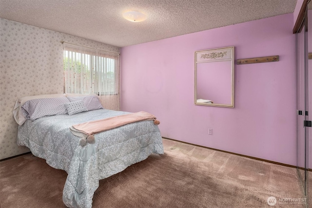 335 3rd Ave S Unit 203, Edmonds, WA 98020 - carpeted bedroom with a textured ceiling and wallpapered walls