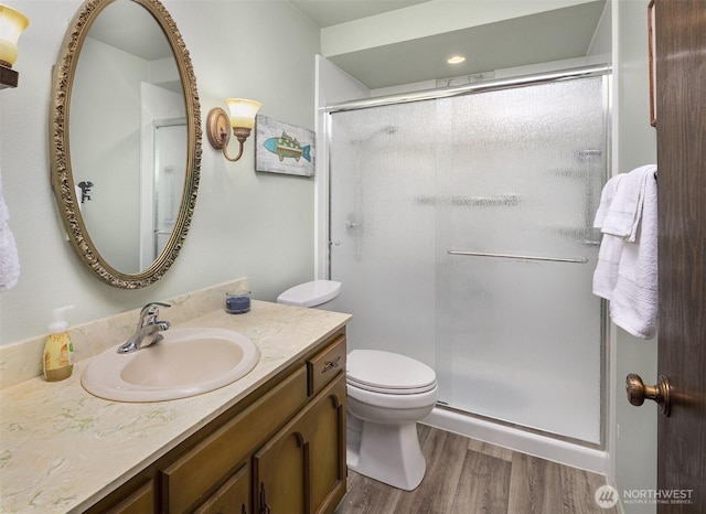335 3rd Ave S Unit 203, Edmonds, WA 98020 - full bathroom with vanity, a shower stall, and wood finished floors