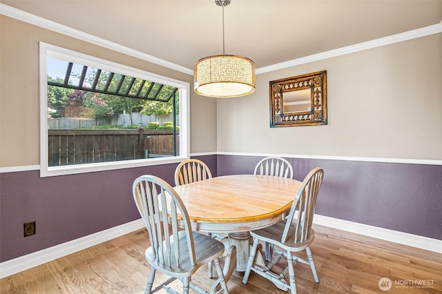 16508 39th Street Ct E, Lake Tapps, WA 98391 - dining area with wood finished floors and crown molding