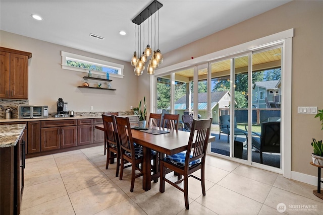 1132 121st St E, Tacoma, WA 98445 - dining area featuring light tile patterned flooring, a chandelier, and recessed lighting