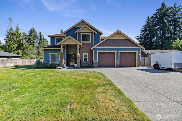 1132 121st St E, Tacoma, WA 98445 - craftsman-style house featuring concrete driveway, an attached garage, and stone siding