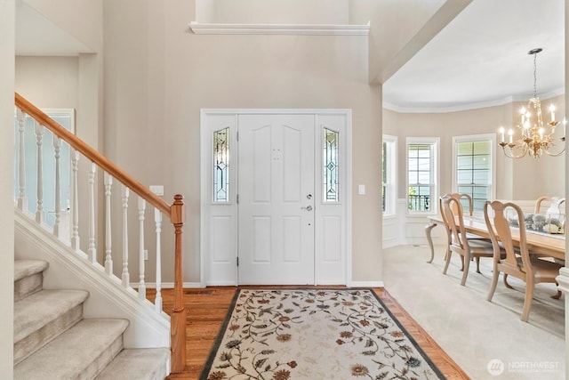 3819 Ridge Ct, Mount Vernon, WA 98274 - entryway featuring a chandelier, stairway, light wood-type flooring, and ornamental molding