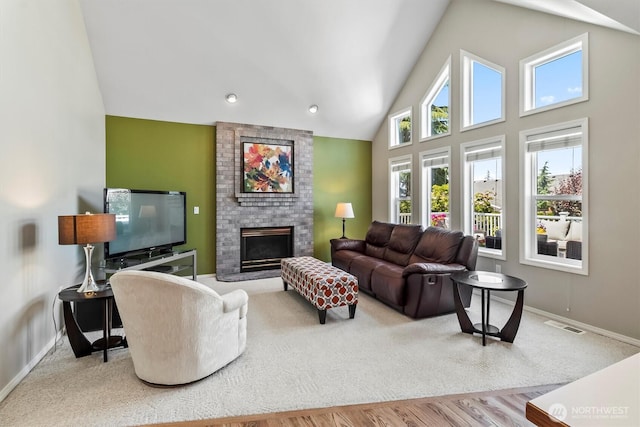 3819 Ridge Ct, Mount Vernon, WA 98274 - living room with a brick fireplace, plenty of natural light, high vaulted ceiling, and wood finished floors