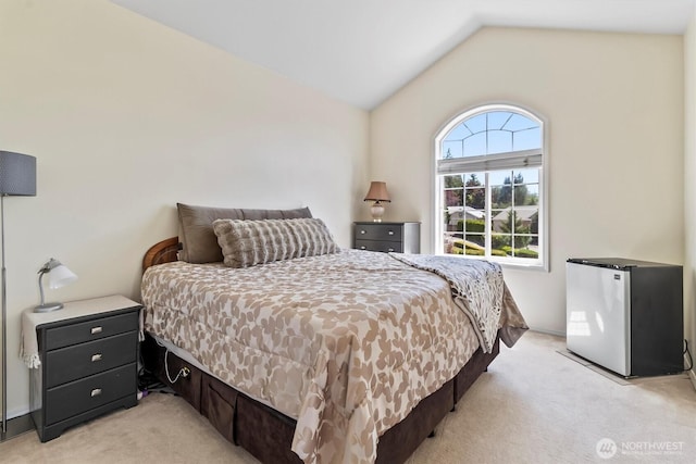 3819 Ridge Ct, Mount Vernon, WA 98274 - bedroom featuring light colored carpet, freestanding refrigerator, and vaulted ceiling