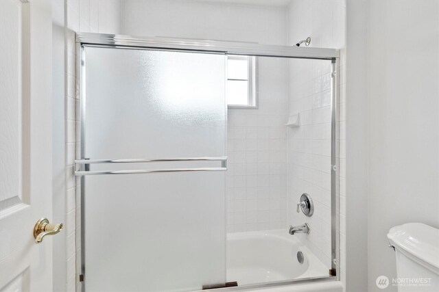 3819 Ridge Ct, Mount Vernon, WA 98274 - bathroom featuring combined bath / shower with glass door and toilet