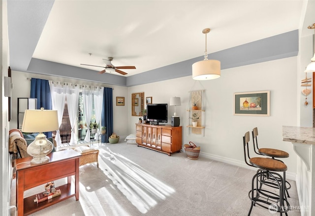 910 Harris Ave Unit 304, Bellingham, WA 98225 - carpeted living area with ceiling fan and baseboards