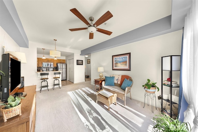 910 Harris Ave Unit 304, Bellingham, WA 98225 - living area with a ceiling fan and light colored carpet
