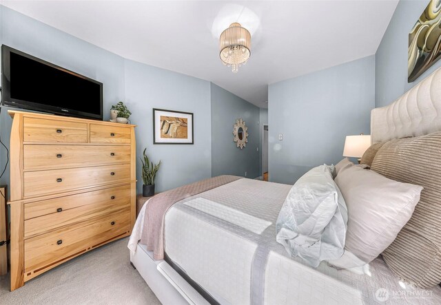 910 Harris Ave Unit 304, Bellingham, WA 98225 - bedroom featuring light colored carpet and a chandelier