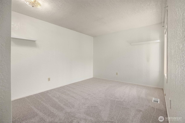 9119 185th Pl SW, Edmonds, WA 98026 - carpeted empty room featuring a textured ceiling
