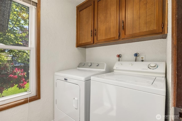 9119 185th Pl SW, Edmonds, WA 98026 - washroom featuring a textured wall, cabinet space, and washer and clothes dryer