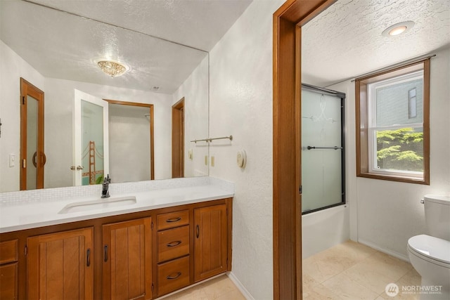 9119 185th Pl SW, Edmonds, WA 98026 - full bath with a textured ceiling, vanity, and enclosed tub / shower combo