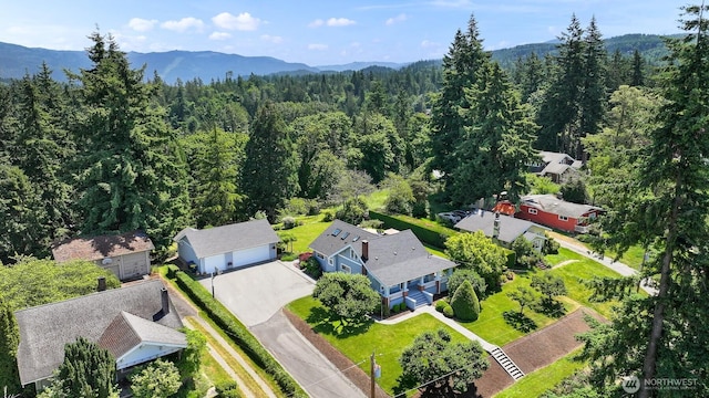 1800 Dakin St, Bellingham, WA 98229 - drone / aerial view of a heavily wooded area and a mountainous background