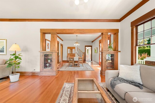 1800 Dakin St, Bellingham, WA 98229 - living room with a chandelier, light wood-style floors, and stairs