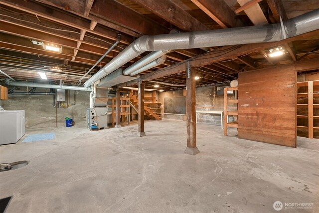 1800 Dakin St, Bellingham, WA 98229 - unfinished below grade area featuring washing machine and dryer, stairway, heating unit, and electric panel